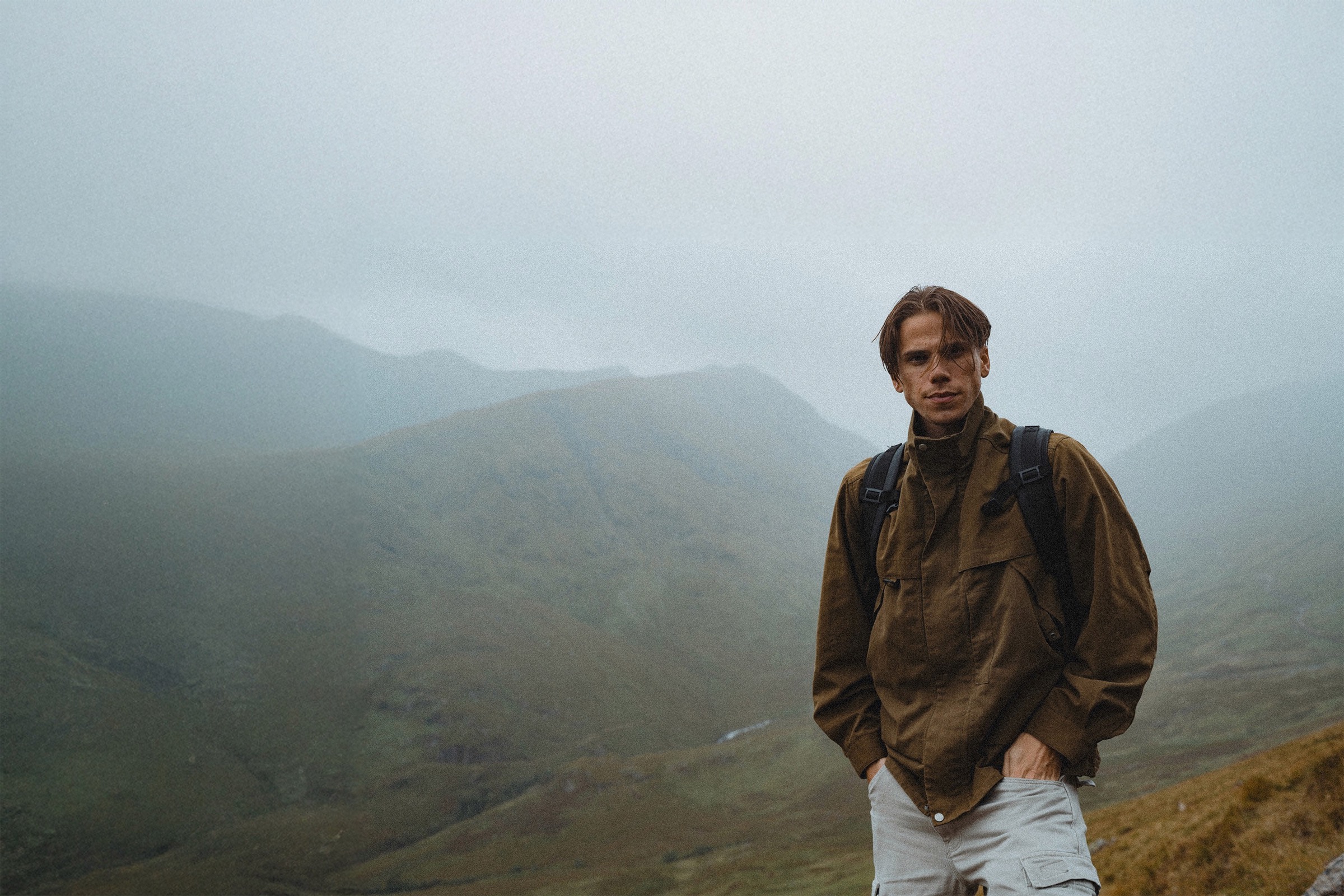 Rafe Johnson hiking among misty mountains in Scotland