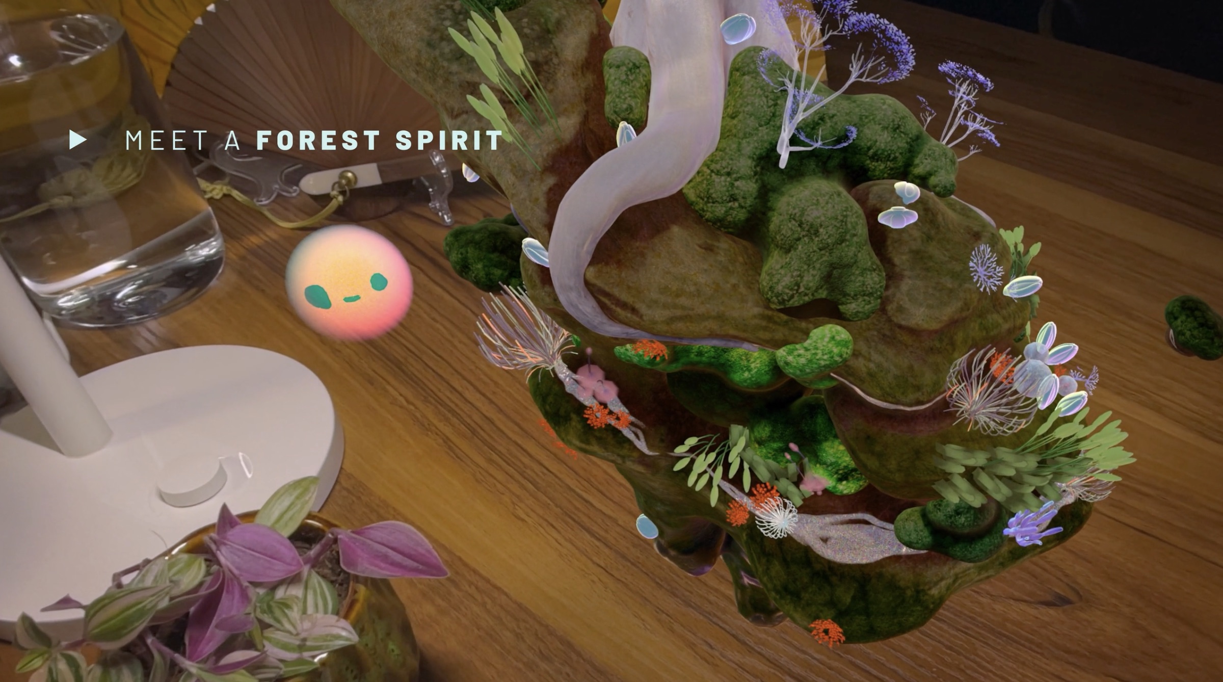 In-headset capture — the Wisp forest spirit beside its mossy world on a desk, labelled Meet a Forest Spirit